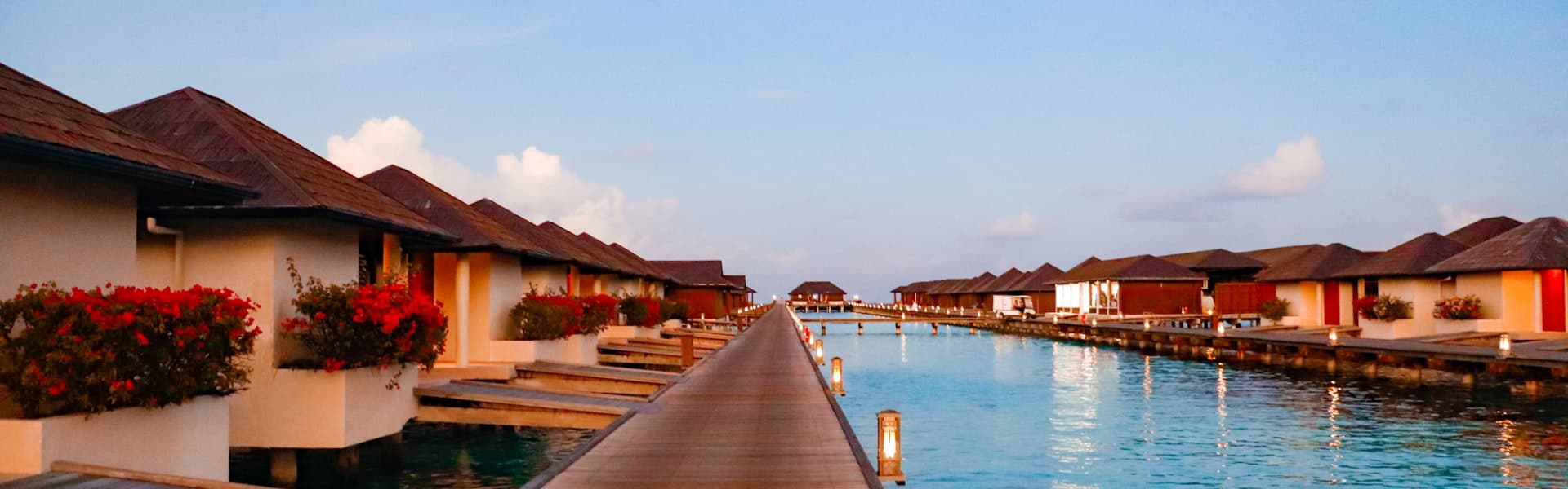 Maldives overwater villas at sunset